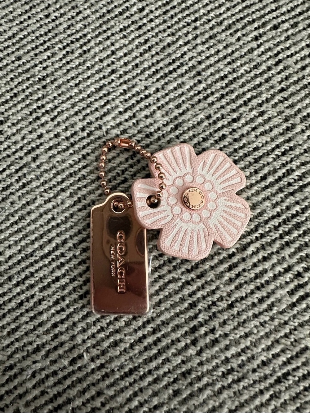 Coach rose gold hang tag with pink leather flower bag charm new